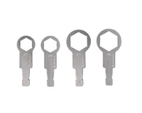 Four metallic tools on a white background