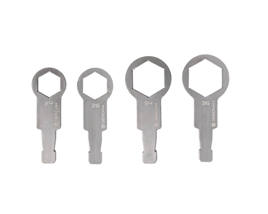 Four metallic tools on a white background